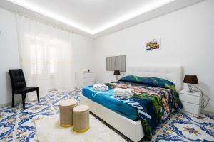 Ένα ή περισσότερα κρεβάτια σε δωμάτιο στο Max e Charlie Suites