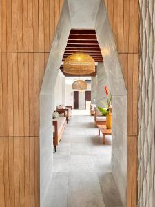 a hallway with couches and tables in a building at Hotel Tepeu in Santa Elena +34 photos