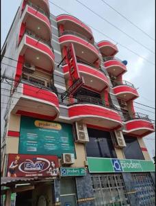 a tall building with signs in front of it at Hotel Oasis in Riberalta +6 photos