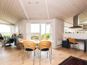 a dining room with a table and chairs at 6 person holiday home in Karrebæksminde-By Traum in Karrebæksminde +19 photos