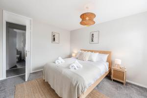 Ένα ή περισσότερα κρεβάτια σε δωμάτιο στο Saxmundham Stay: Park & Unwind