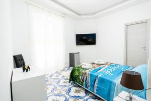 Μια τηλεόραση ή/και κέντρο ψυχαγωγίας στο Max e Charlie Suites