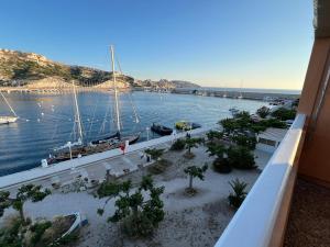 a view of a harbor with boats in the water at L'Albatros in Marseille