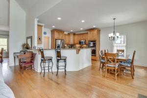 a kitchen and living room with a table and chairs at Home on Lake Lanier with Dock and Water Views in Gainesville