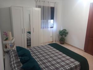 Posteľ alebo postele v izbe v ubytovaní Casa El Cercado