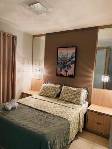 Ένα ή περισσότερα κρεβάτια σε δωμάτιο στο Apartamento Praia Mar Grosso 150 Metros do Mar