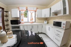 Køkken eller tekøkken på Casa em Passo Fundo com Churrasqueira