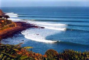 a group of waves in the ocean on a coast at G SPOT UPPER LEVEL with spa in Raglan
