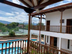 a view of the pool from the balcony of a house at Refugio de Paz Casa en Anapoima in Anapoima