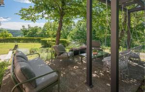 a screened in porch with a table and chairs at Lovely Home In Tinjan in Tinjan +45 photos