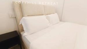 Postel nebo postele na pokoji v ubytování CofyHill Retreat