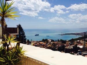 a view of the ocean from a balcony at Villa Greta Hotel Rooms & Suites in Taormina
