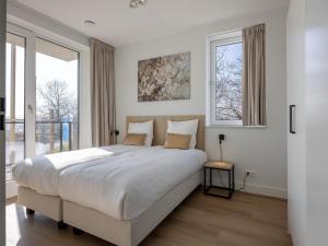 Ένα ή περισσότερα κρεβάτια σε δωμάτιο στο Apartment in Kortgene with Harbor Views