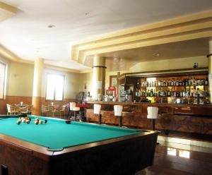 a pool table in a room with a bar at Hotel Park Grumentum in Grumento Nova