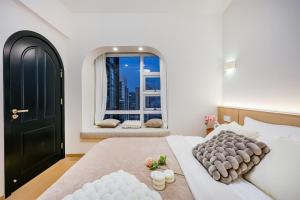 Postel nebo postele na pokoji v ubytování Baihong Riverview aparment-Chongqing Jiefangbei + 37 fotografií