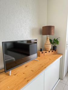 a flat screen tv sitting on top of a counter at Tropi-k in Le Gosier