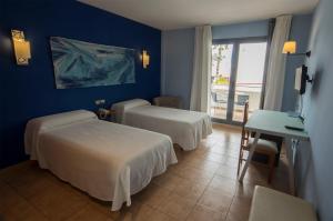 Postel nebo postele na pokoji v ubytování Hotel La Posada De Paco - Spa & Adults Friendly