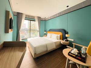 Postel nebo postele na pokoji v ubytování A25 Hotel - 130 Bà Triệu + 14 fotografií