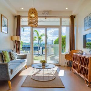 a living room with a couch and a table at The Mansion Boutique Hotel in Mabalacat
