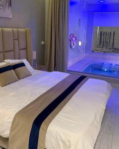 a bedroom with a bed with a tub in it at شاليهات جاليكا in Taif +9 photos