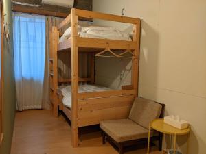 Ліжко або ліжка в номері Tomarotto Hostel