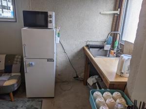 Кухня або міні-кухня у Tomarotto Hostel
