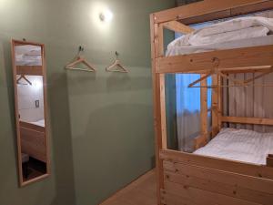 Ліжко або ліжка в номері Tomarotto Hostel