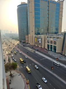 a busy city street with cars on a highway at Partition in a shared apartment for rent in Abu Dhabi