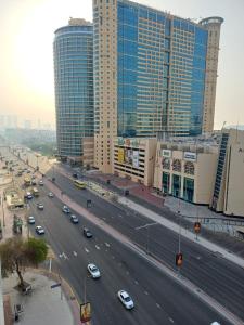 a busy city street with cars driving on a highway at Partition in a shared apartment for rent in Abu Dhabi