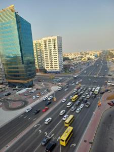 a busy highway in a city with cars and buildings at Partition in a shared apartment for rent in Abu Dhabi