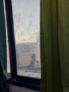 a view of the desert from a window in a room at Partition in a shared apartment for rent in Abu Dhabi