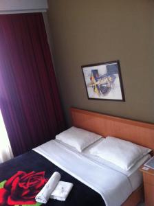 Postel nebo postele na pokoji v ubytování Hotel Central