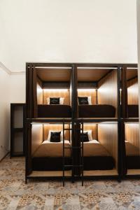 a group of bunk beds in a room at Way Kap Hostel Arequipa in Arequipa