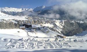 a town in the snow on a snowy mountain at Hotel Garni Elfriede inklusive Super Sommer Card in Serfaus