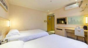 City Comfort Inn Zhanjiang Xuwen Port Wharf Chengdong客房内的一张或多张床位