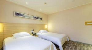 City Comfort Inn Zhanjiang Xuwen Port Wharf Chengdong客房内的一张或多张床位