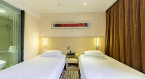 City Comfort Inn Zhanjiang Xuwen Port Wharf Chengdong客房内的一张或多张床位