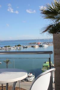 a view of a marina with boats in the water at Hostal Brisa Marina in Port d'Alcudia