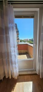 a window with a view of a balcony at Pokoje U Wandy in Łeba