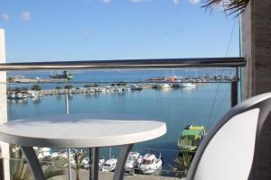 a view of a marina from a balcony at Hostal Brisa Marina in Port d'Alcudia