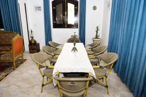 a conference room with a long table and chairs at Flamingo Boutique hotels in Luxor