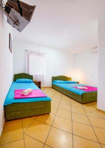 Кровать или кровати в номере Apartments Dalila