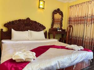 Postel nebo postele na pokoji v ubytování Lotus Blanc Homestay
