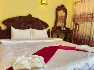 Postel nebo postele na pokoji v ubytování Lotus Blanc Homestay