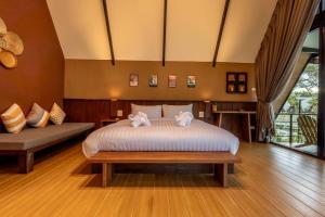 Postel nebo postele na pokoji v ubytování Hom I Din Farm and Homestay