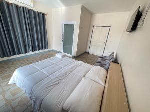 Postel nebo postele na pokoji v ubytování Oh Taley Resort