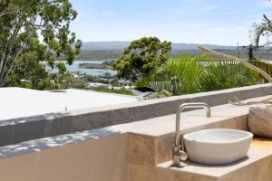 a bathroom sink with a view of a pool at Noosa Blue Resort in Noosa Heads