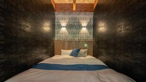 Postel nebo postele na pokoji v ubytování Wat Resort プライベート ヴィラ ひだいちのみや