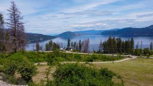 a view of a lake with mountains in the background at Panoramic Acres B & B - Lake & Mountain Views in Vernon
