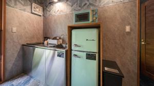 Kuchyň nebo kuchyňský kout v ubytování Wat Resort プライベート ヴィラ ひだいちのみや